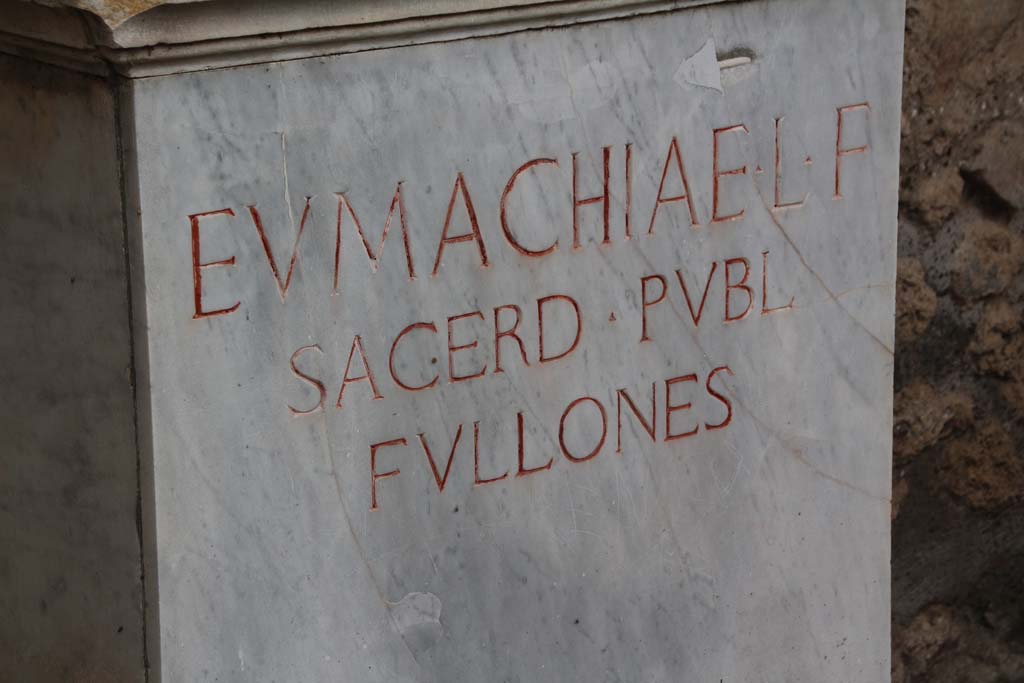 VII.9.1 Pompeii. April 2014. Inscription on base of statue of Eumachia. Photo courtesy of Klaus Heese.