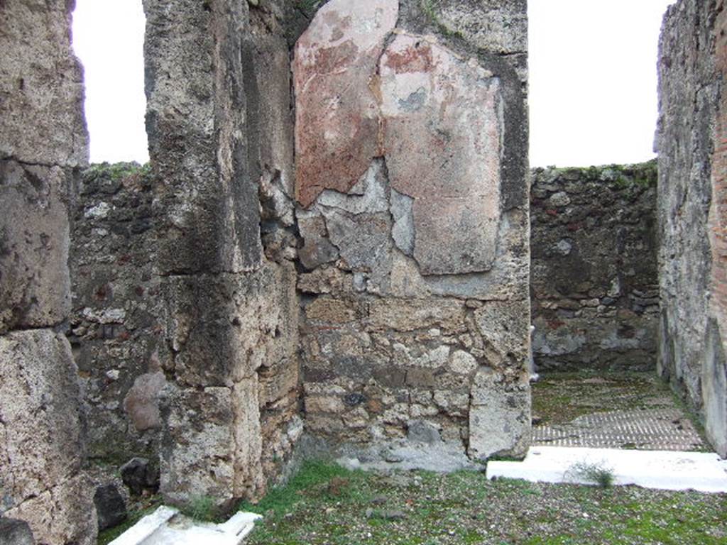 VII.9.47 Pompeii. December 2005. North-east corner of room 1, the atrium. Doorways to shop and room 2.
