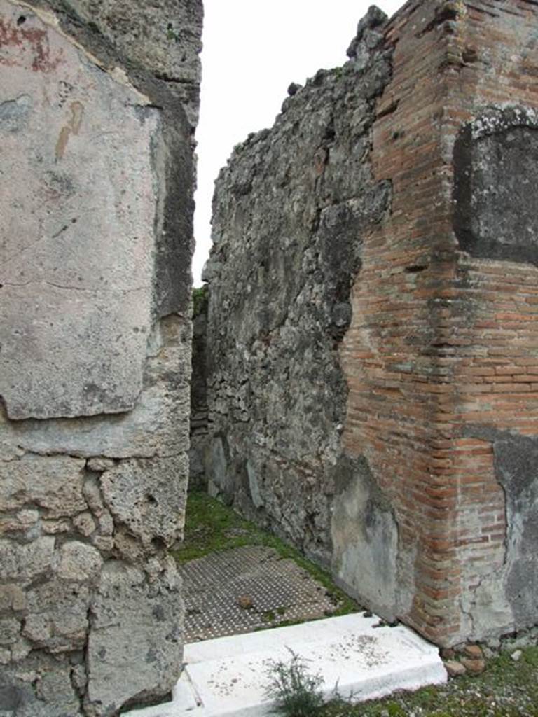 VII.9.47 Pompeii. March 2009. Doorway to room 2, cubiculum showing south wall.