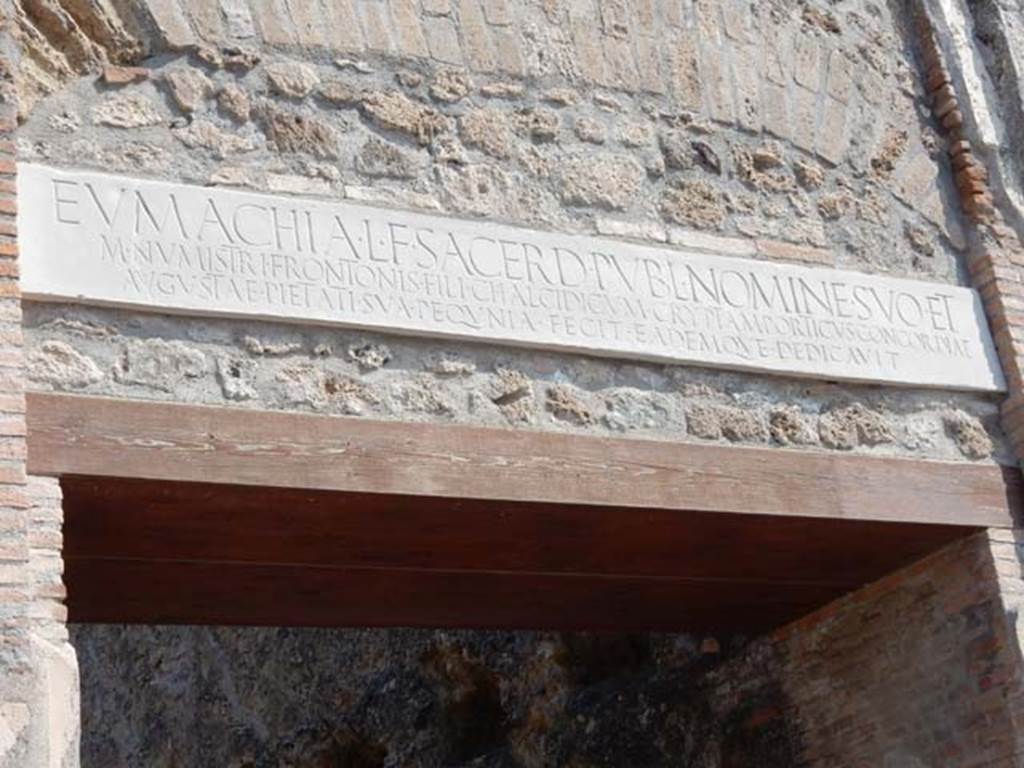 VII.9.67 Pompeii. May 2015. Copy of original marble plaque with inscription, above the doorway. Photo courtesy of Buzz Ferebee.
