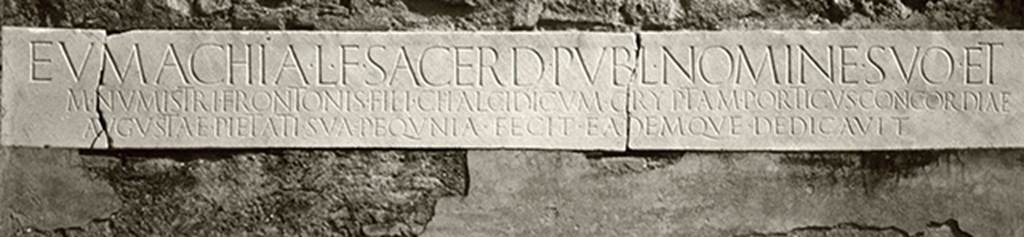 VII.9.67 Pompeii. Original marble plaque with inscription, above the doorway.
