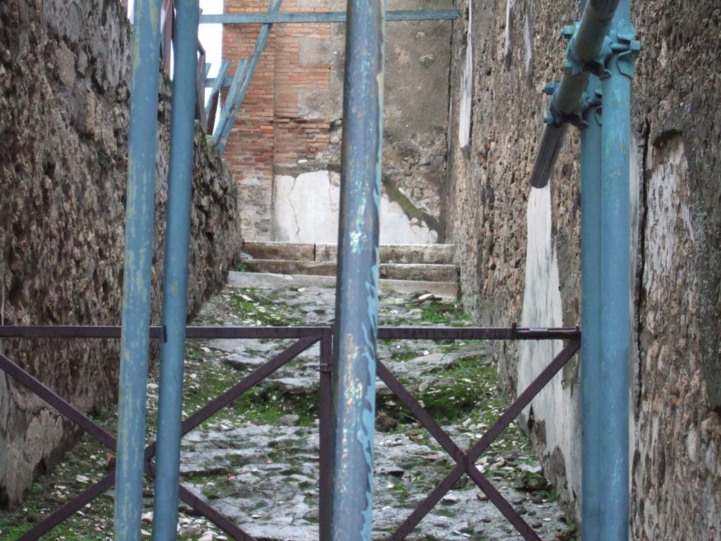 VII.9.67 Pompeii. December 2005. Stairs and ramp to upper floor, at rear of Eumachia’s Building.