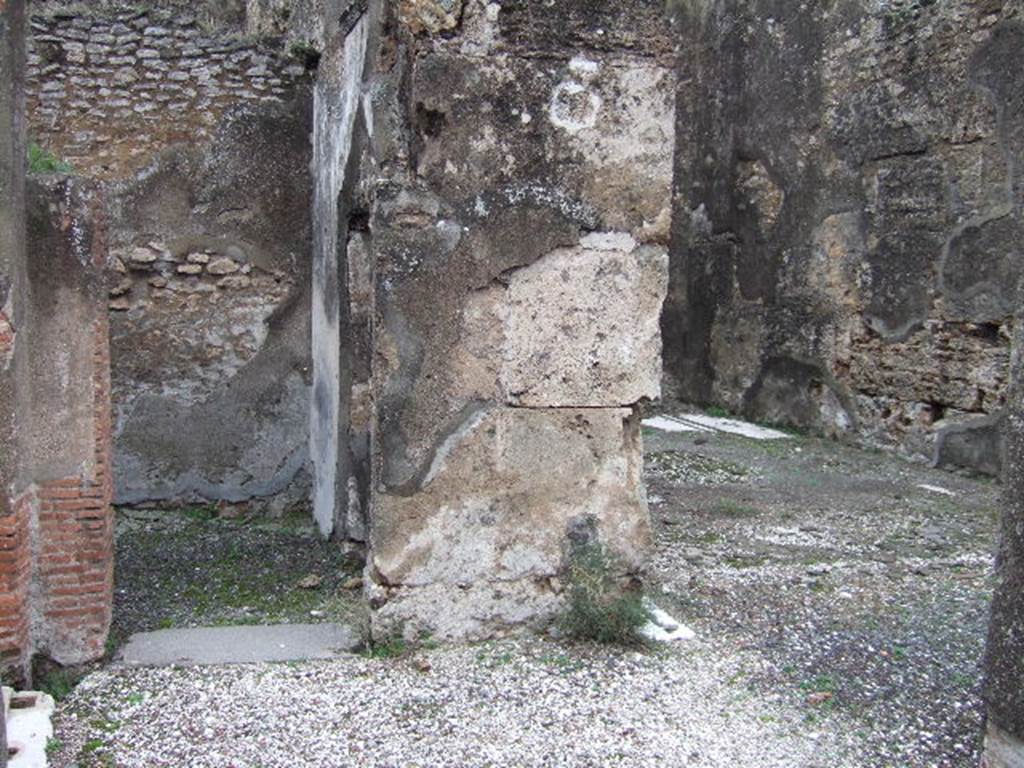 VII.10.5 Pompeii. December 2005. North side of peristyle with doorway to cubiculum and exedra.  According to Bragantini et al, on the east and west walls of this cubiculum, the painted black zoccolo and white middle zone could be seen.
 See Bragantini, de Vos, Badoni, 1986. Pitture e Pavimenti di Pompei, Parte 3. Rome: ICCD. (p.183)
