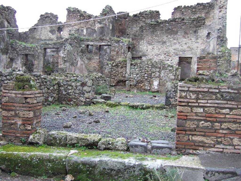 VII.10.10 Pompeii. December 2005. Entrance doorway, looking west across shop.
