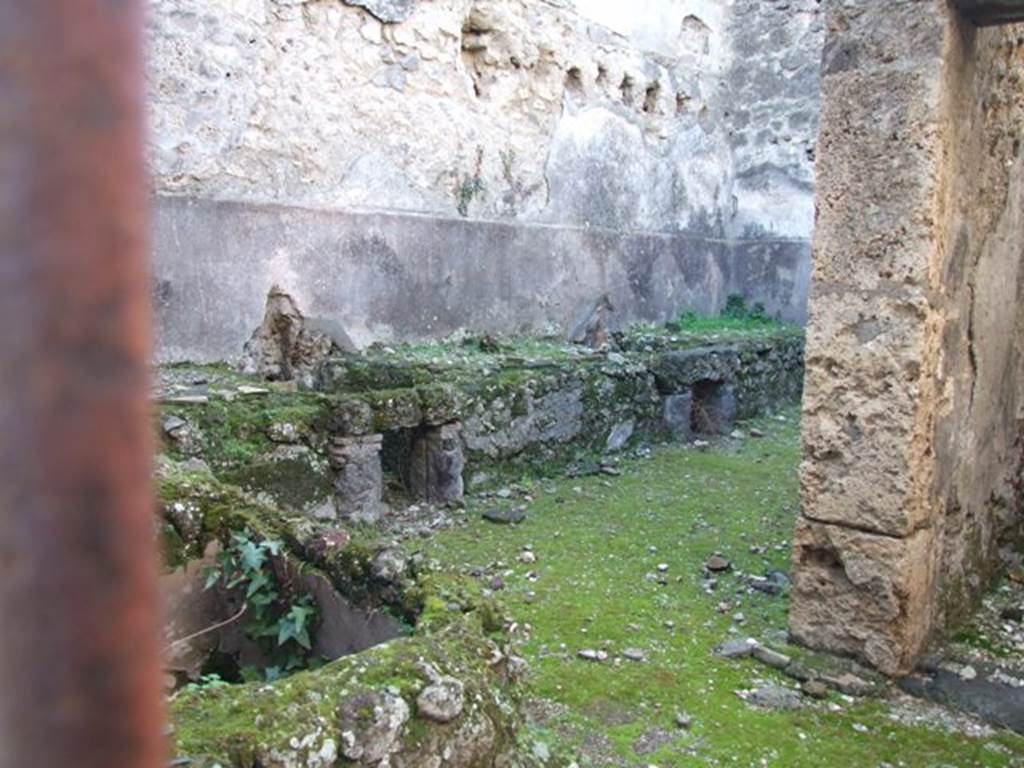 VII.10.13 Pompeii. December 2007. Looking west from entrance doorway towards basin and two hearths, near south wall.