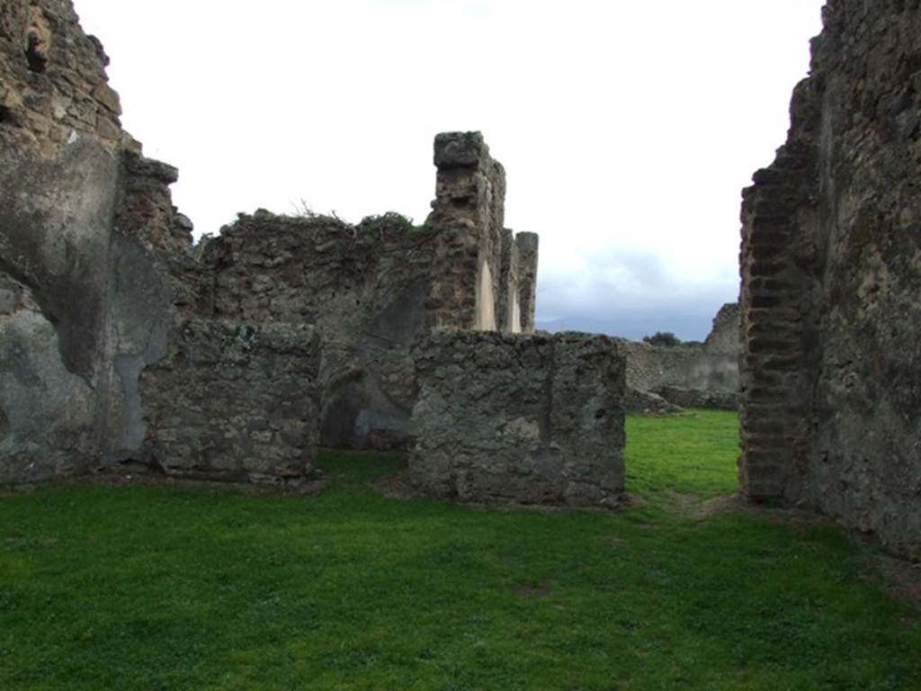 VII.12.4 Pompeii.  December 2007.  South wall with small rear room and doorway to atrium of VII.12.3.