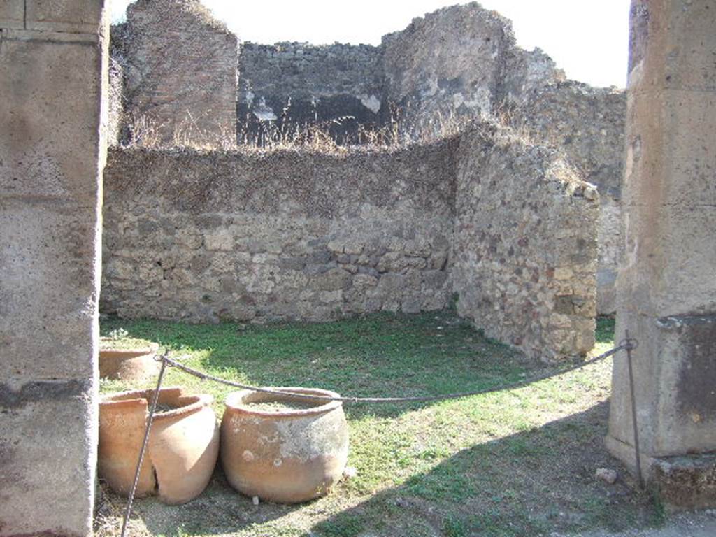 VII.12.9 Pompeii. September 2005. Looking south-west across shop, with doorway in west wall to VII.12.8.