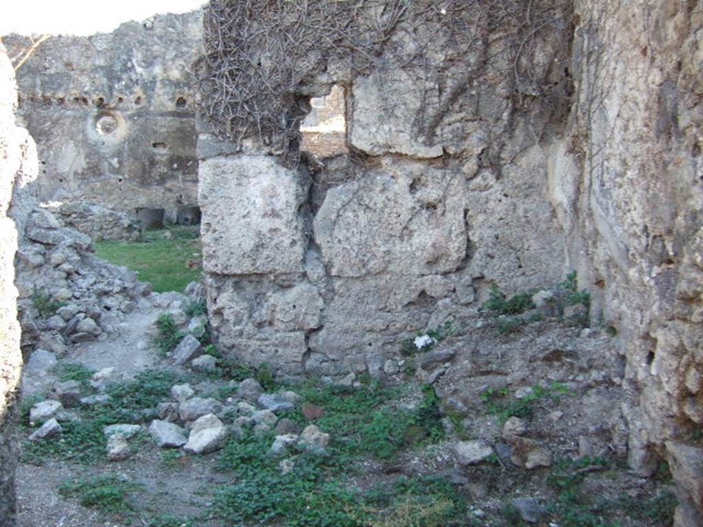 VII.12.12 Pompeii. December 2004. South wall of yard, and south-west corner.