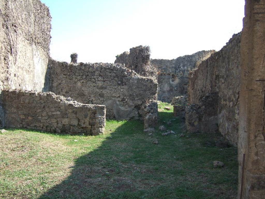 VII.12.13 Pompeii. September 2005. Looking south to rear room on left, and corridor to bakery area on right.