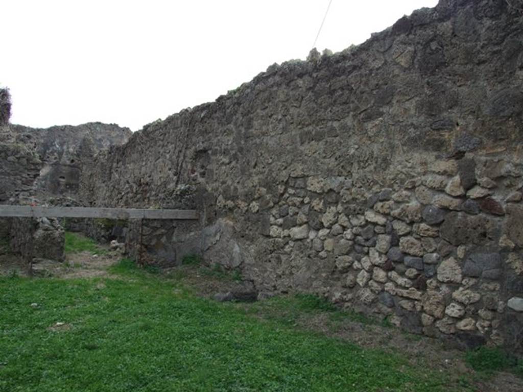 VII.12.13 Pompeii. December 2007. West wall of shop and corridor to bakery area.