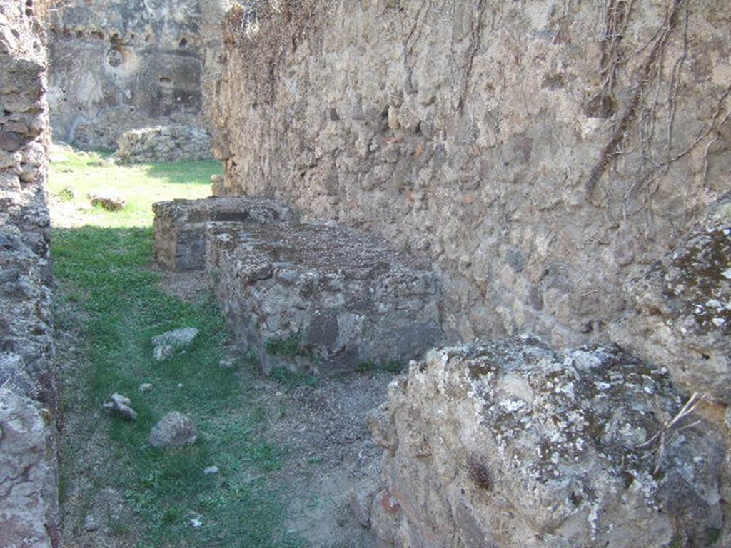 VII.12.13 Pompeii. September 2005. Corridor to bakery area. West wall with podiums.