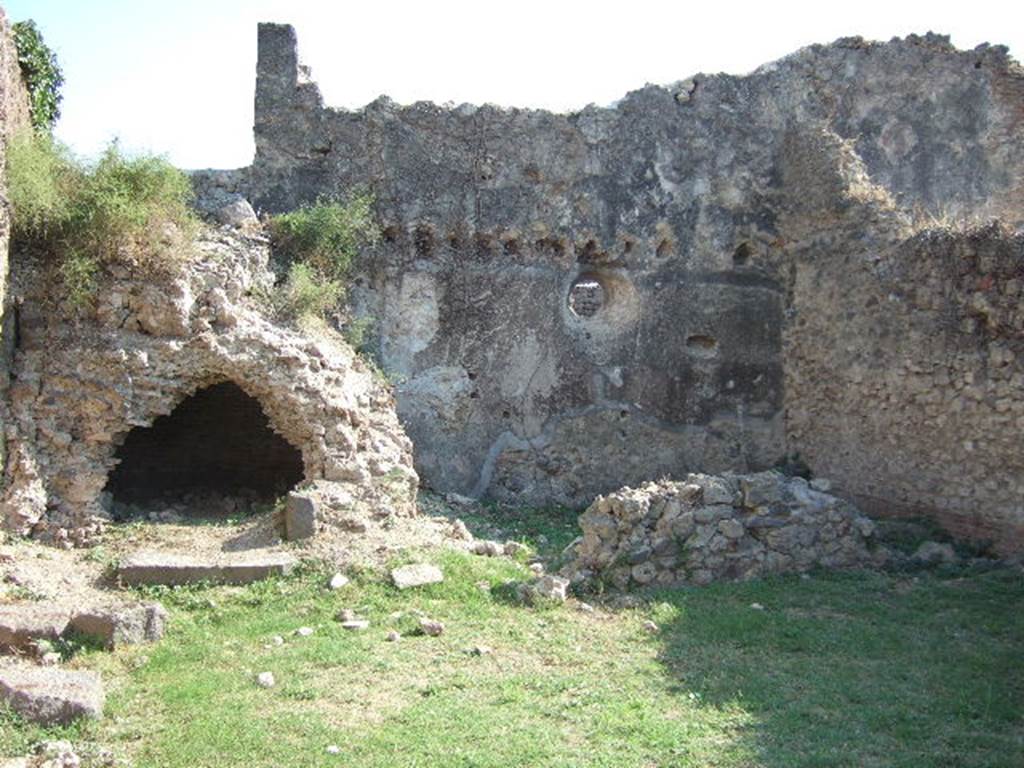 VII.12.13 Pompeii. September 2005. South wall with oven and bakery area.