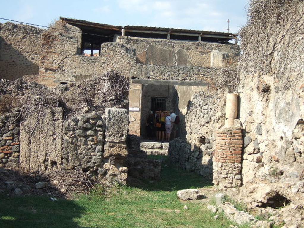 VII.12.13 Pompeii. September 2005. Looking north from bakery to front of shop.