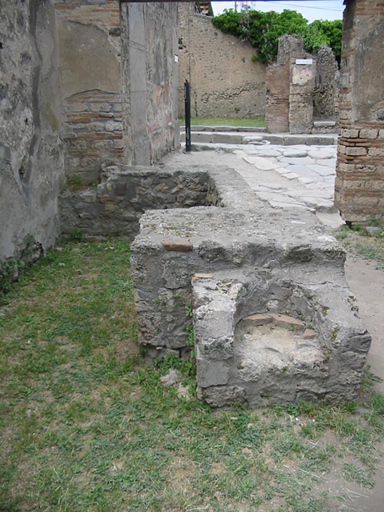 VII.12.15 Pompeii. May 2003. 
Looking north from rear of counter and hearth, towards Via degli Augustali. Photo courtesy of Nicolas Monteix.
