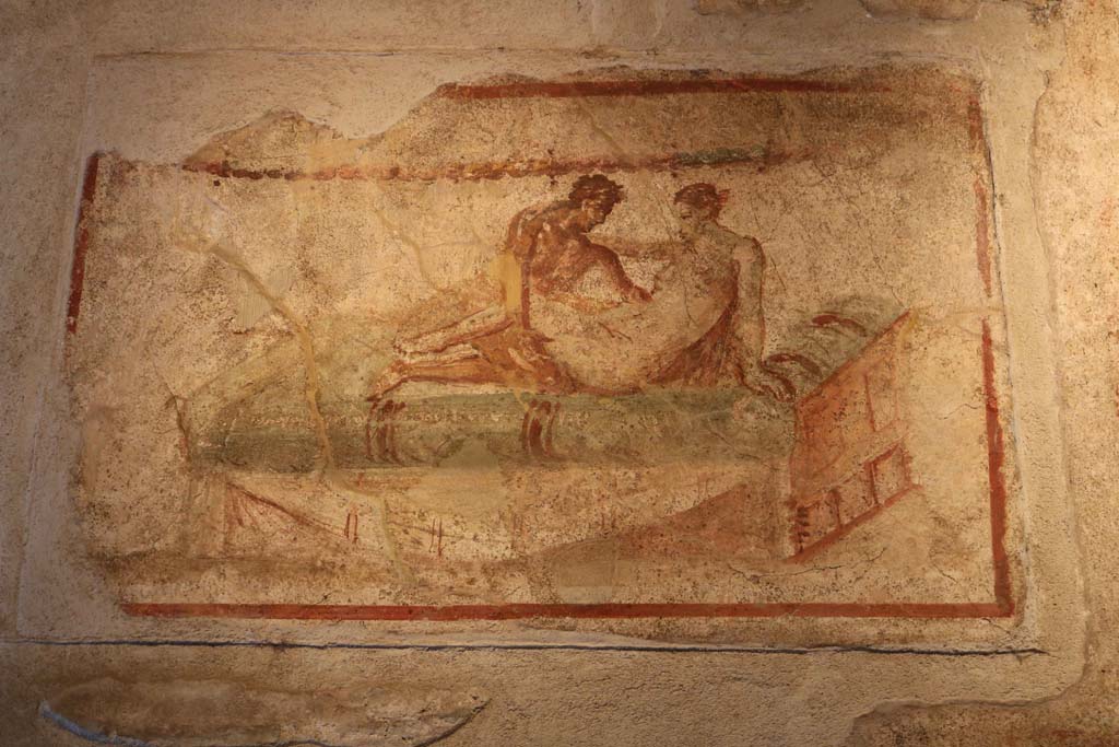 VII.12.18 Pompeii. December 2018. Painted erotic wall fresco on frieze. Photo courtesy of Aude Durand.