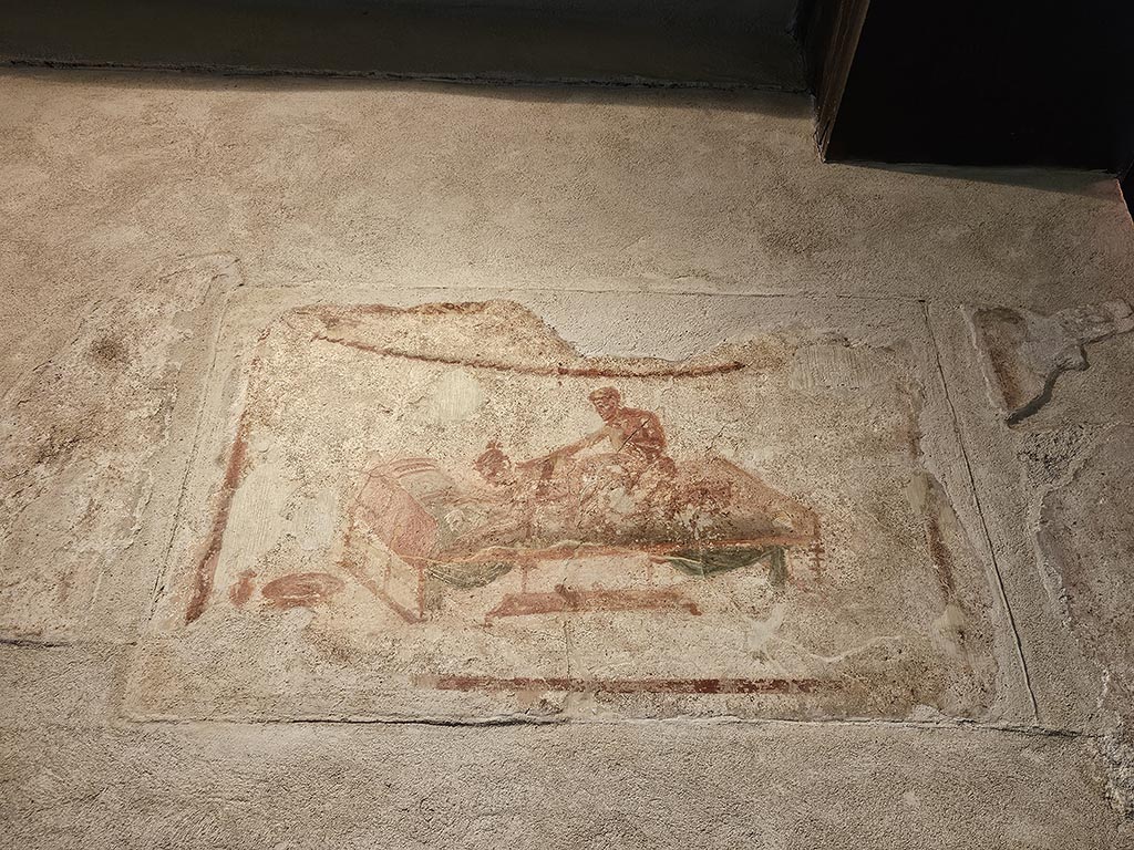 VII.12.18 Pompeii. November 2024. Painted erotic wall fresco on frieze. Photo courtesy of Annette Haug.