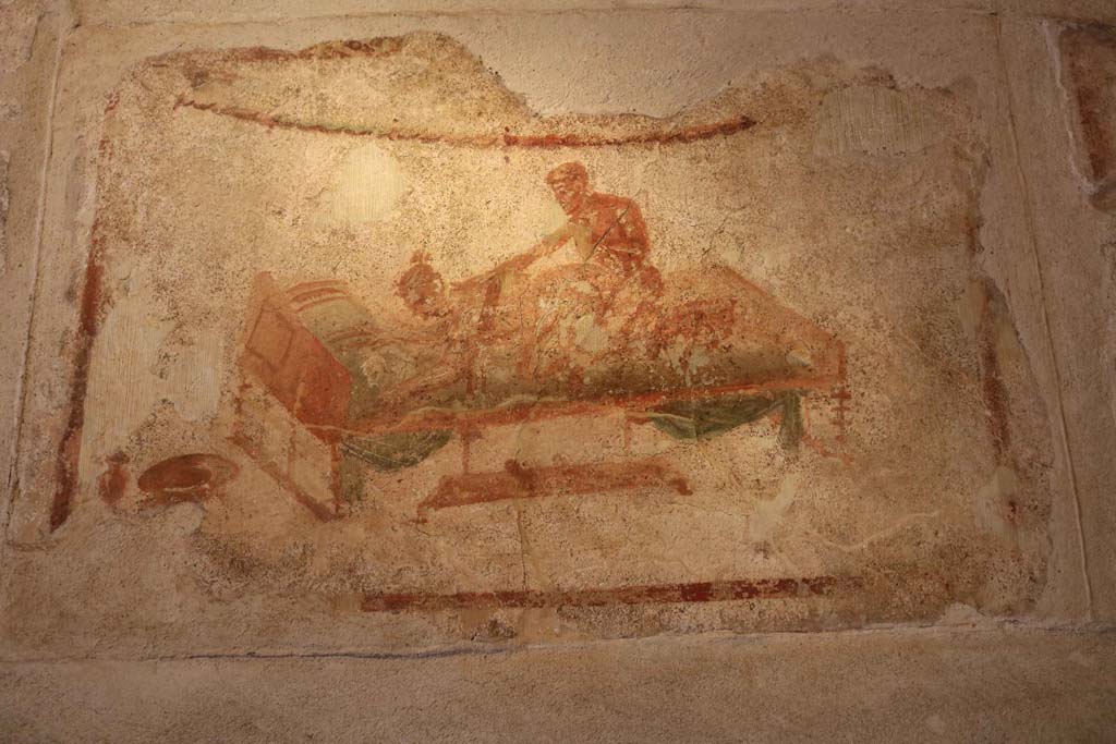 VII.12.18 Pompeii. December 2018. Painted erotic wall fresco on frieze. Photo courtesy of Aude Durand.