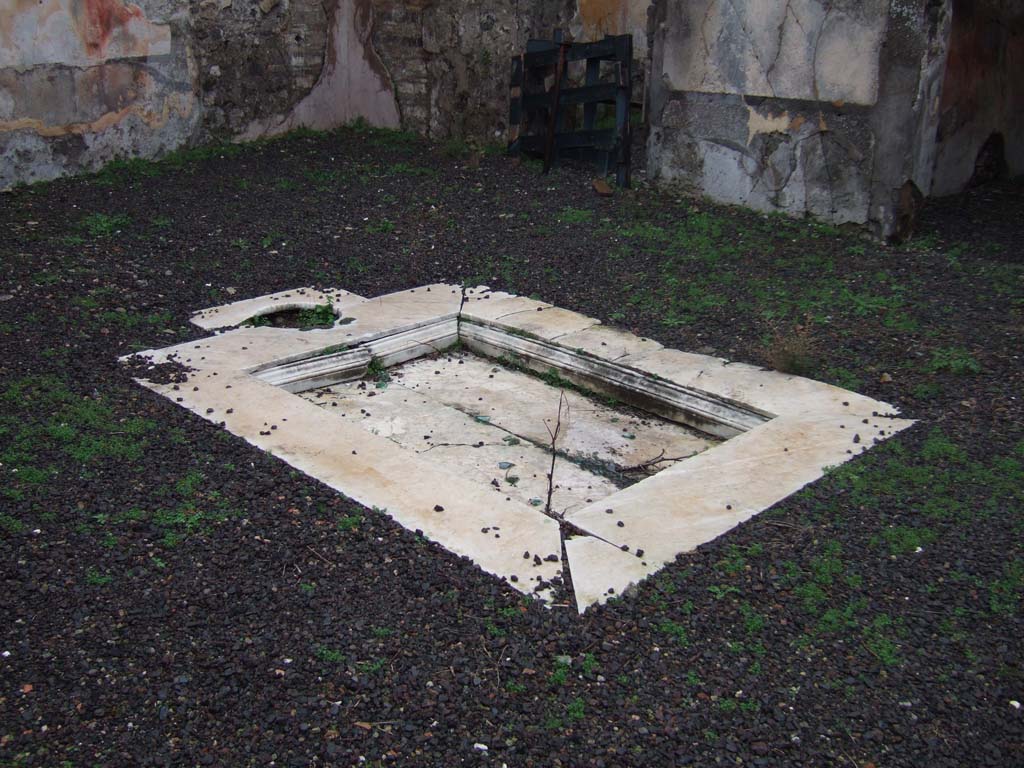 VII.12.21 Pompeii. December 2005. Looking north-east across marble impluvium in atrium.