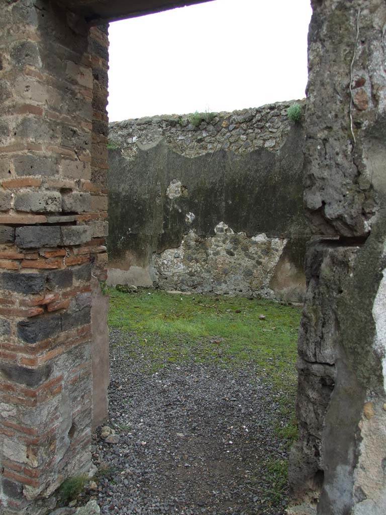 VII.12.21 Pompeii. March 2009. Doorway to room on south-east side of atrium.
