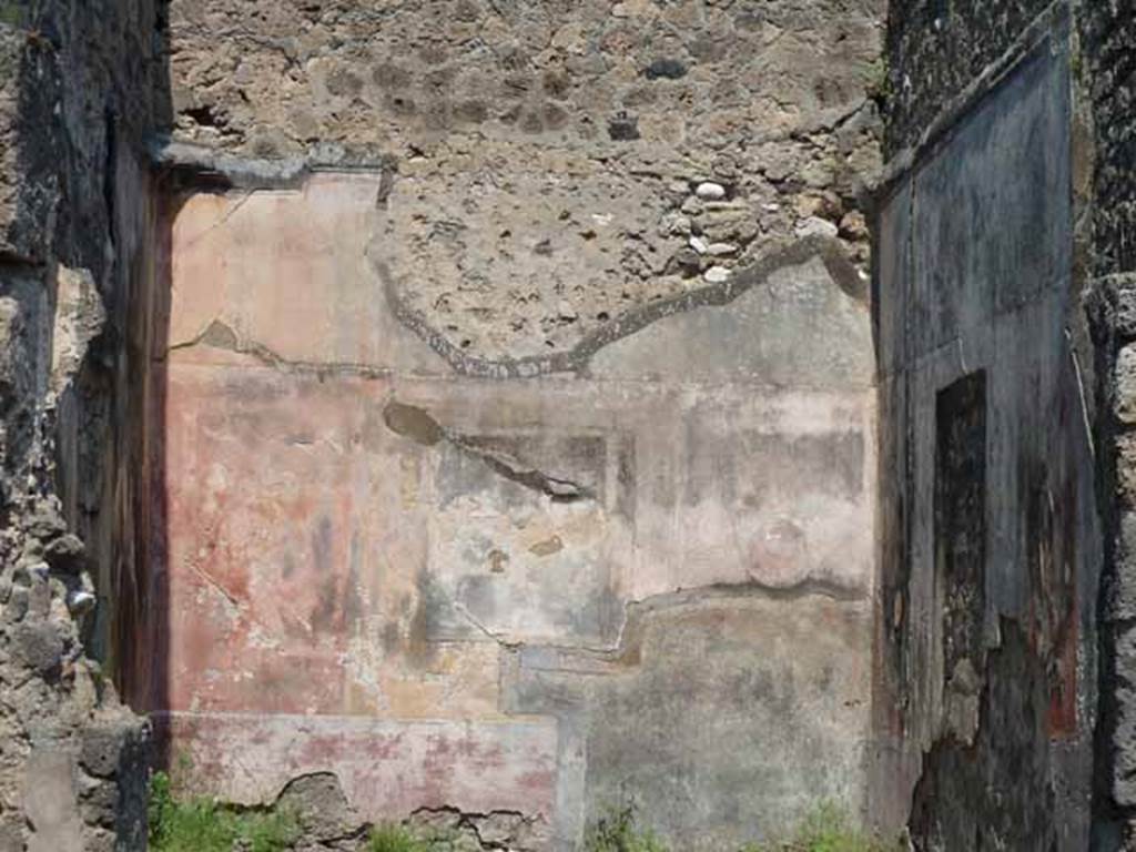 VII.12.26 Pompeii. May 2010. North wall of triclinium, with remains of wall painting. According to Breton, found on the wall at the back, would have been Ariadne abandoned. See Breton, Ernest. 1870. Pompeia, Guide de visite a Pompei, 3rd ed. Paris, Guerin. 
