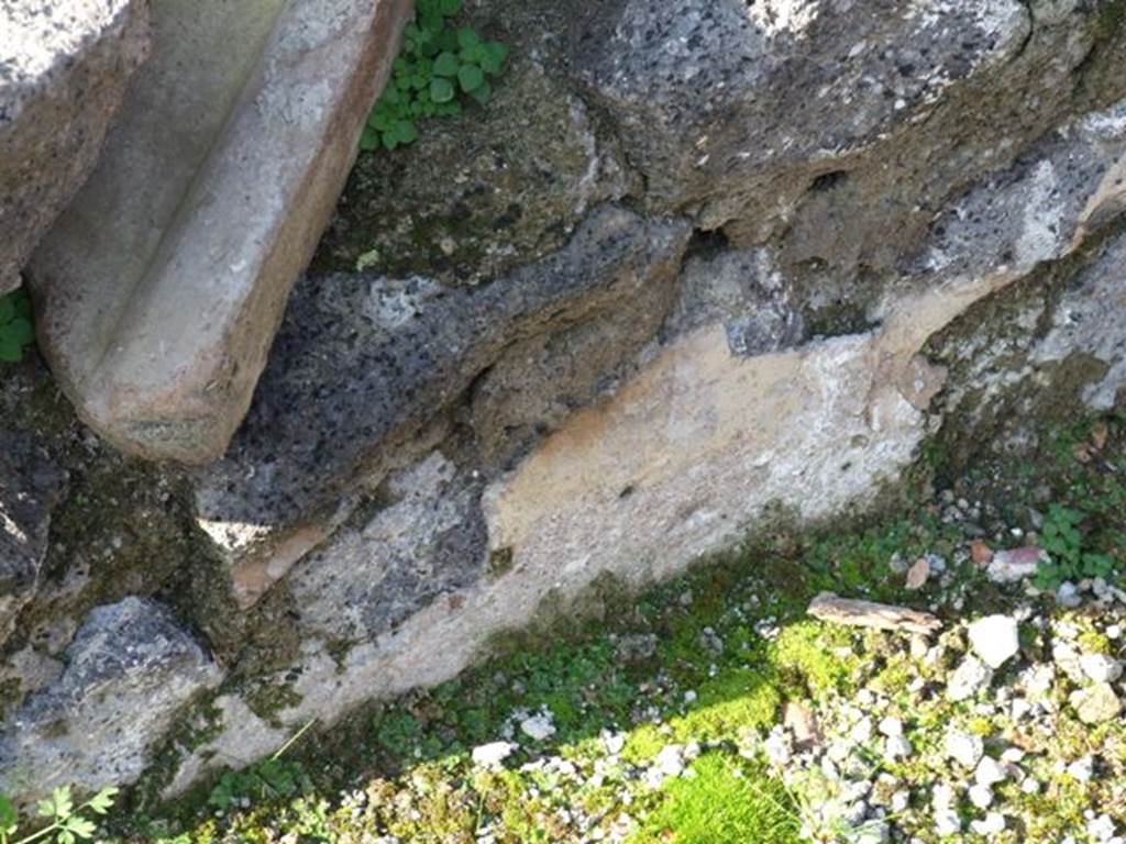 VII.12.27 Pompeii. December 2007. Area on west side outside the entrance, remains of plaster.