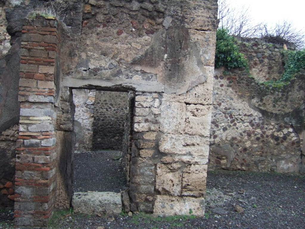 VII.13.8 Pompeii. December 2005. Doorway to room in north west corner of atrium.
Looking north.