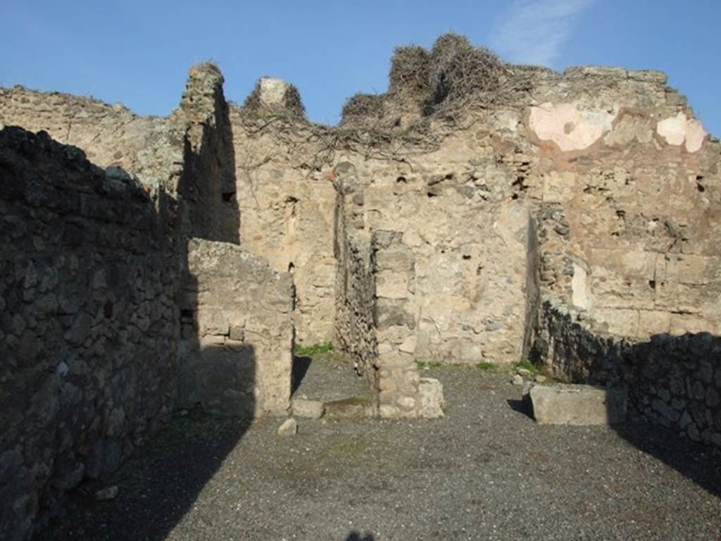 VII.14.2 Pompeii. December 2007. Looking north across the shop to doorways to two rear rooms. According to Eschebach, on the left was a room with steps to upper floor, and a latrine. On the right was a cubiculum.
See Eschebach, L., 1993. Gebäudeverzeichnis und Stadtplan der antiken Stadt Pompeji. Köln: Böhlau. (p.337)
