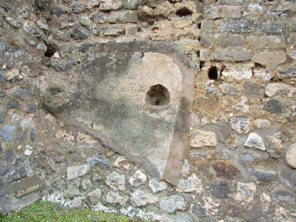 VII.14.5 Pompeii. March 2009. Room 18, west wall above hearth or bench.