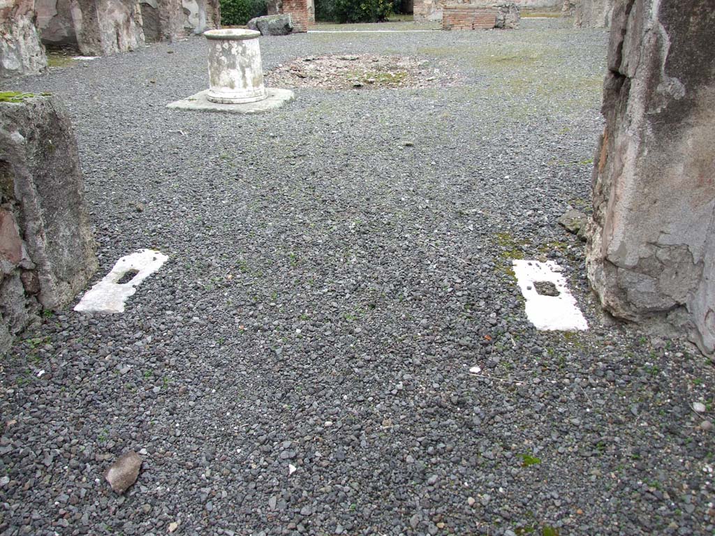 VII.14.5 Pompeii. March 2009. Floor at north end of fauces, remains of door pivots, and floor of atrium.