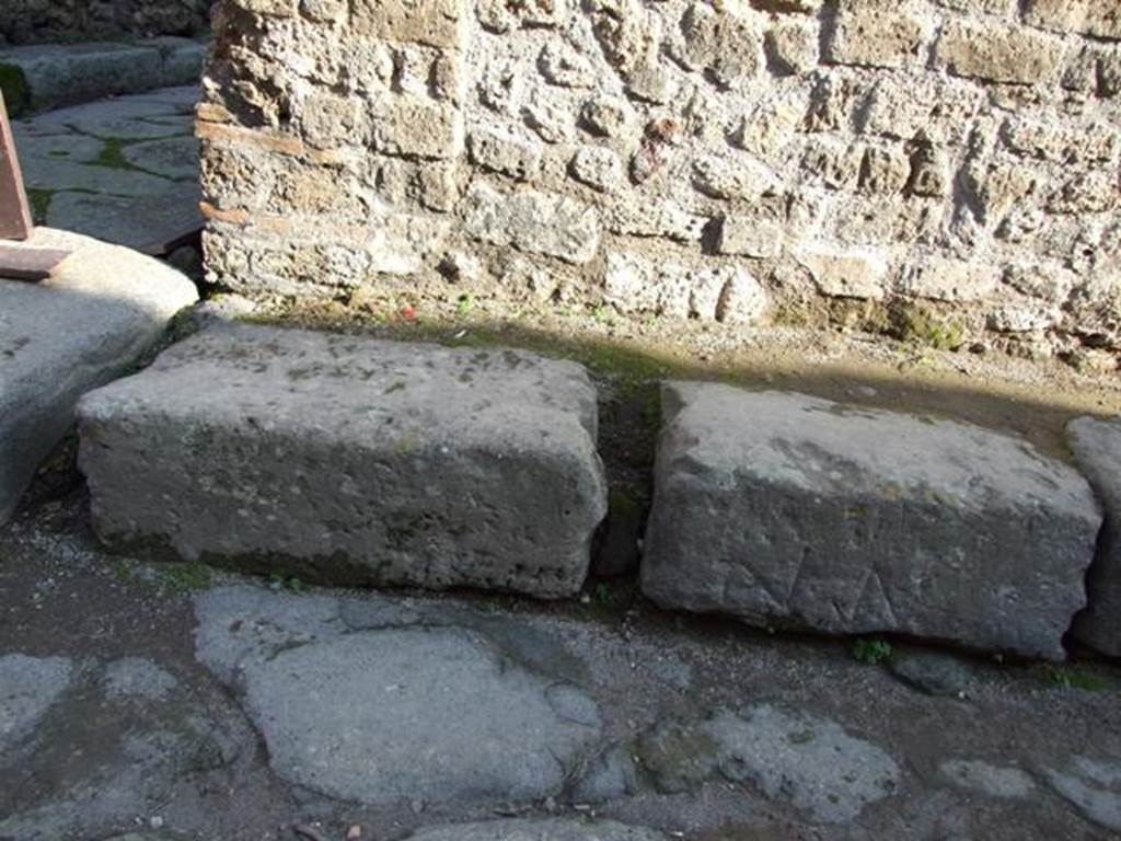 Corner of Vicolo della Maschera and Vicolo degli Scheletri on the east side.
Kerb with incised marks. December 2007.