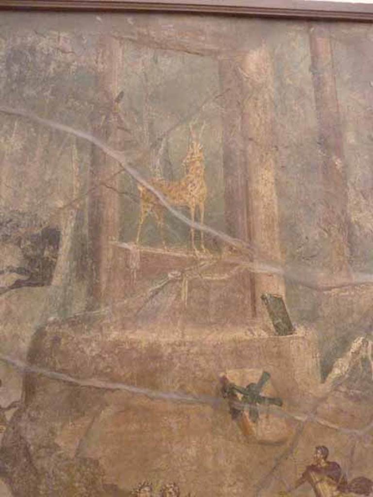 VII.15.2 Pompeii. May 2010. Detail from Slaughter of the Niobids from north wall of apodyterium. A tetrastyle temple with a spotted hind, the symbol of Artemis. Now in Naples Archaeological Museum.  Inventory number 111479.