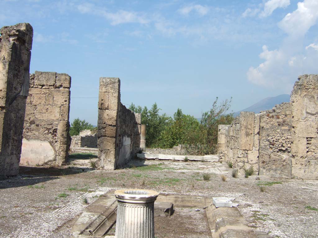 VII.15.2 Pompeii. September 2005. Looking across impluvium in atrium towards tablinum.