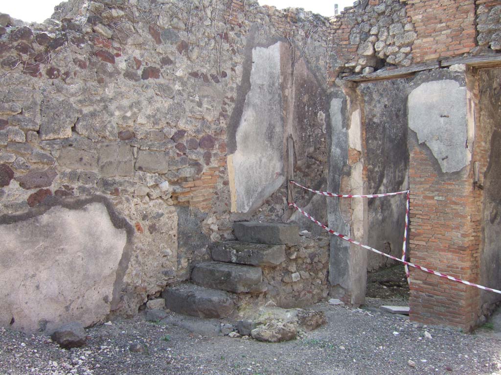 VII.15.8 Pompeii. September 2005. Steps to upper floor in south-west corner of atrium.