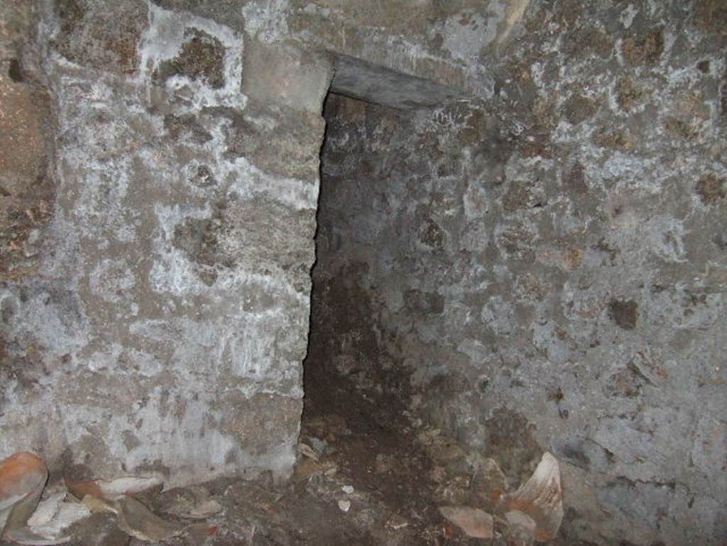 VII.15.16 Pompeii. May 2006. Granary. Room X, west wall with doorway to corridor Y.
