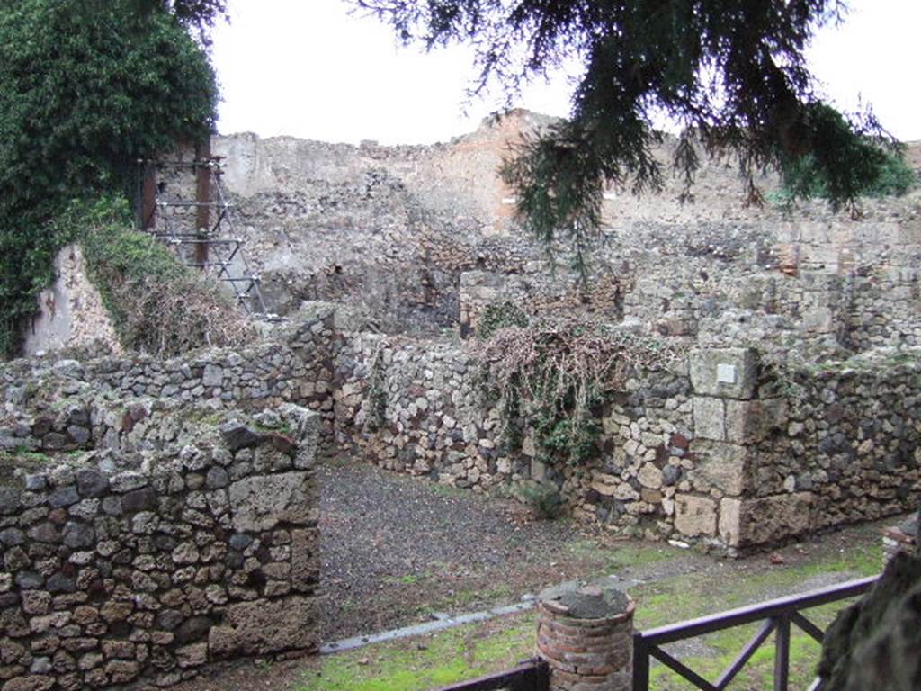 VII.16.2 Pompeii. September 2005. Entrance doorway, taken from Temple of Venus. According to Eschebach, this would have contained a masonry counter with a small hearth. Near the entrance would have been a wooden steps to the half mezzanine. Nothing remains.  
See Eschebach, L., 1993. Gebäudeverzeichnis und Stadtplan der antiken Stadt Pompeji. Köln: Böhlau. (p.346)
According to Garcia y Garcia, this thermopolium was completely destroyed by the bombing, including the sales counter.
See Garcia y Garcia, L., 2006. Danni di guerra a Pompei. Rome: L’Erma di Bretschneider. (p131)


