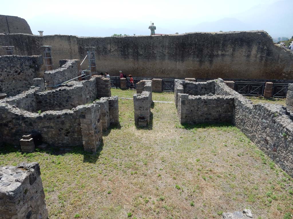 VII.16.4, Pompeii, on left. June 2019. Looking south across the atrium towards entrance doorway, on left. 
The entrance doorway to VII.16.3 is on the right. Photo courtesy of Buzz Ferebee.
According to Fiorelli, 
“La bottega ha la nicchia dei Penati, una finestra nel fondo rispondente nell’atrio indicato, ed una porta che introduceva nel menzionato cubicolo.”
See Pappalardo, U., 2001. La Descrizione di Pompei per Giuseppe Fiorelli (1875). Napoli: Massa Editore. (p.161)
(translation: The shop has the niche of the Penates, a window at the rear corresponding in the indicated atrium, and a doorway that leads into the mentioned cubiculum.”)

