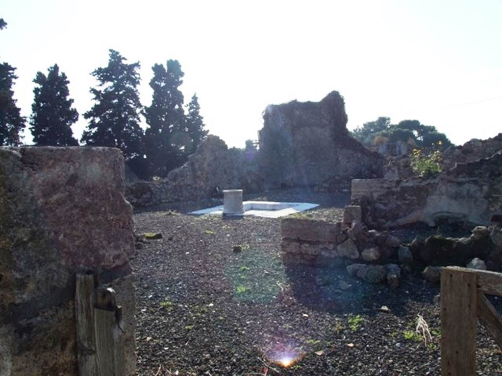 VII.16.10 Pompeii. December 2007. Looking south-west across marble impluvium and puteal in atrium towards tablinum. 
