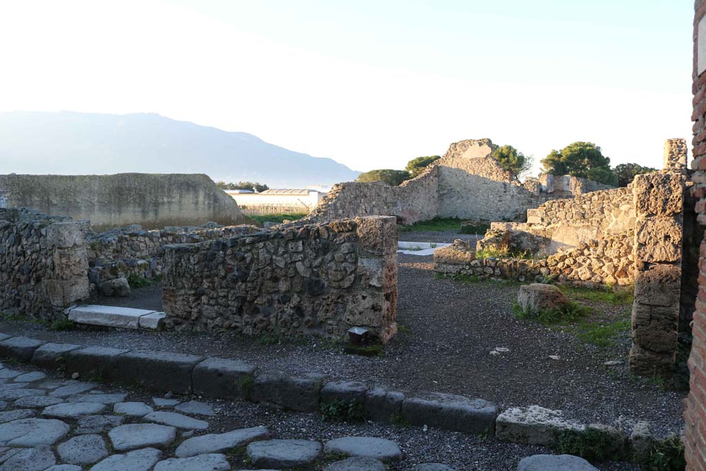 VII.16.11 Pompeii on right, and VII.16.10 on left. December 2018. 
Looking west to entrance doorways. Photo courtesy of Aude Durand.
