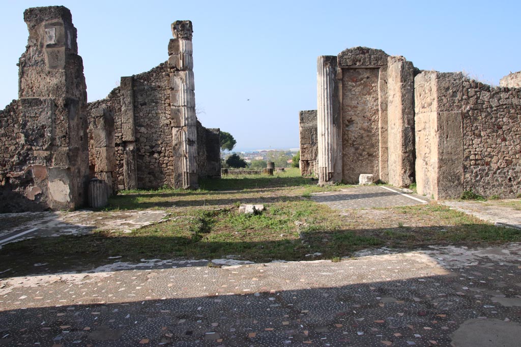 VII.16.13 Pompeii. October 2023.
Looking west across site of impluvium in atrium 2, towards tablinum 9. Photo courtesy of Klaus Heese.
