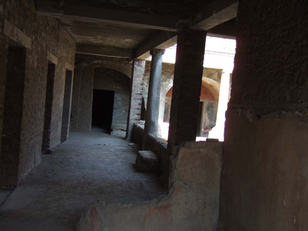 VII.16.17 Pompeii. September 2005. Looking north towards peristyle area, from entrance doorway.
According to Jashemski, the peristyle garden could be reached easily from the entrance doorway on the Vicolo dei Soprastanti.
The peristyle portico was supported by pillars at the corners, and by a column in the middle of each of the four sides.
The entrance to the garden was in the north side.
See Jashemski, W. F., 1993. The Gardens of Pompeii, Volume II: Appendices. New York: Caratzas. (p.203)
