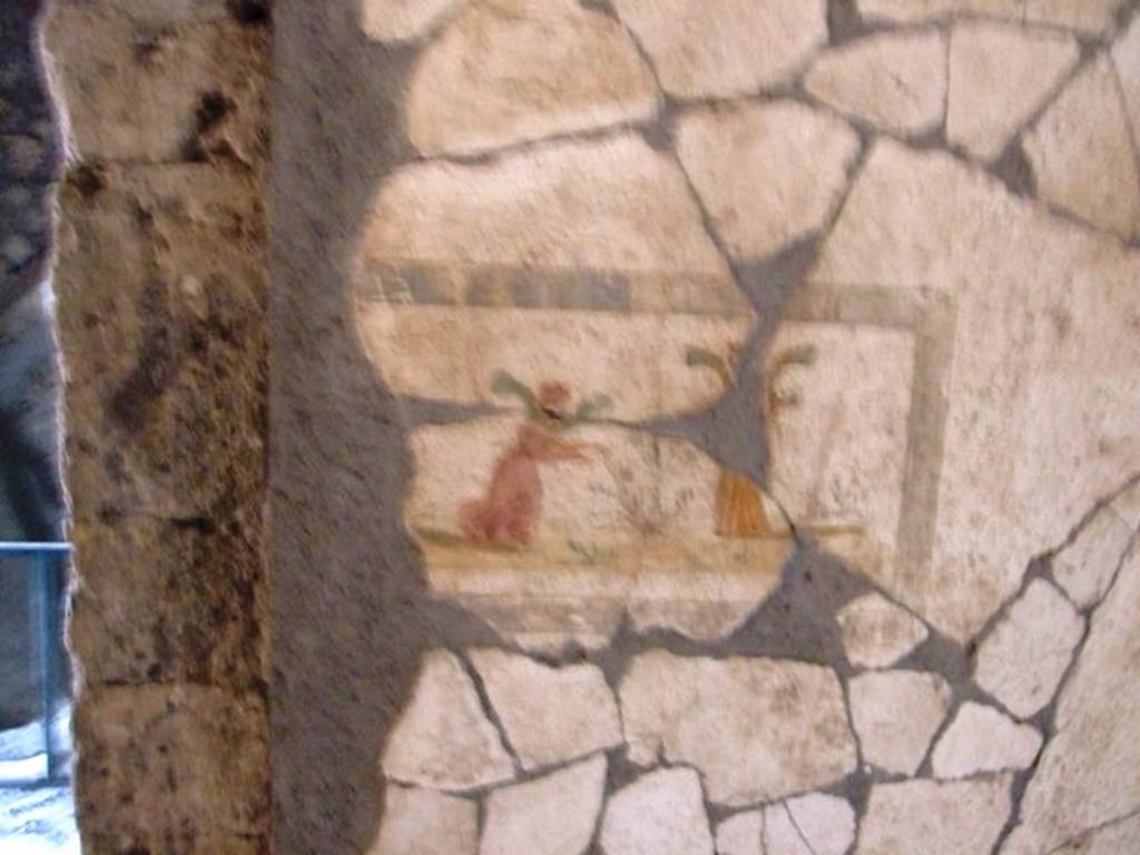 VII.16.17-22 Pompeii. December 2007. Detail of painted wall panel from north wall, east side of doorway.