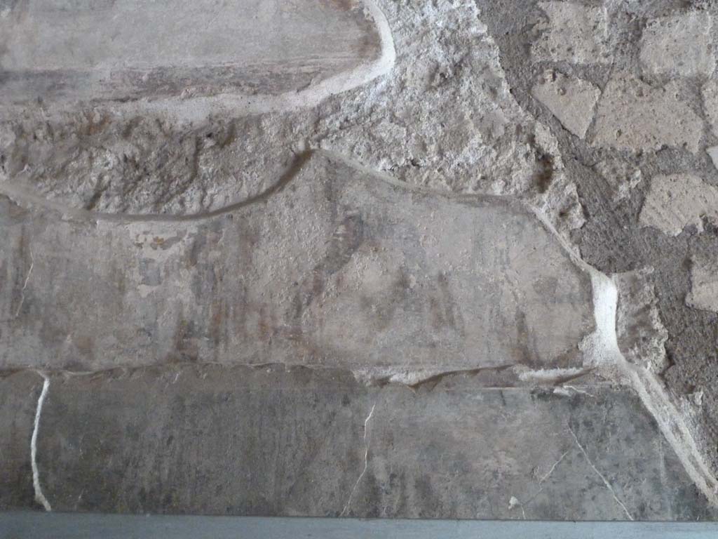 VII.16.a Pompeii. May 2010. Corridor B. Remains of painted plaster. Legs of a gladiator are only just still visible. 
See Jacobelli L., 2003. Gladiators at Pompeii. Rome: L’Erma di Bretschneider, p. 87.
