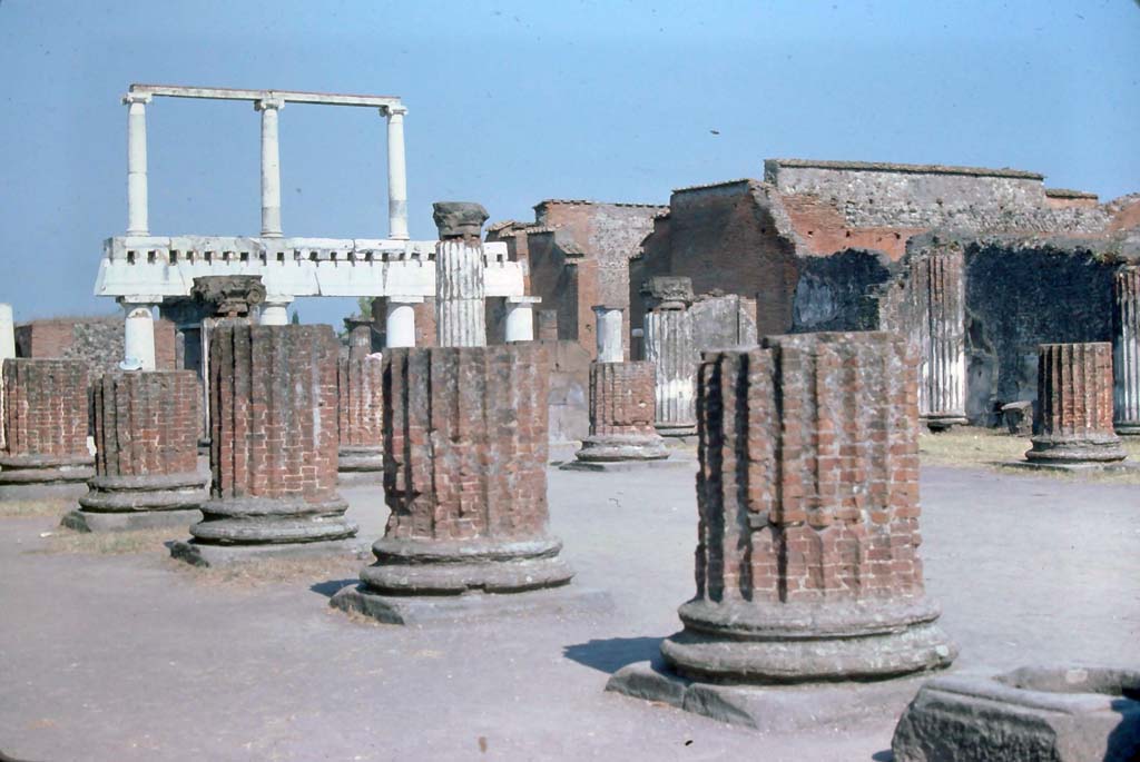 VIII.1.1 Pompeii, 7th August 1976. Looking south-east across Basilica towards south end of Forum.
Photo courtesy of Rick Bauer, from Dr George Fay’s slides collection.
