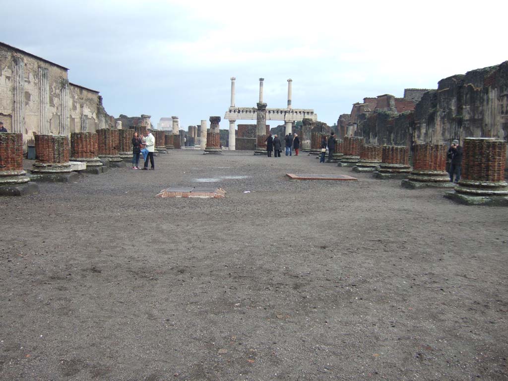 VIII.1.1 Pompeii. December 2005. Basilica, looking east along main central room.
Note, in the background, the three columns on top of four columns in the Forum.