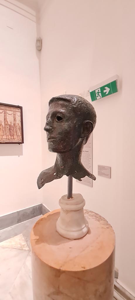 VIII.1.1 Pompeii. April 2023.
Bronze bust found in the area of the Basilica, said to be of Marcellus nephew of Augustus.
On display in “Campania Romana” gallery in Naples Archaeological Museum.
Photo courtesy of Giuseppe Ciaramella.