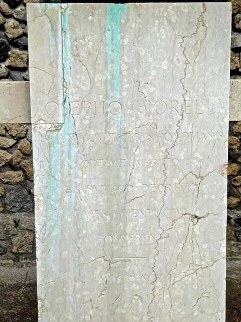Larario dei Pompeianisti. Pompeii. September 2016. Bust of Iosepho Fiorelli.  
The inscription on the front of the pedestal reads:

          IOSEPHO FIORELLI
DE ANTIQVITA TIBUS POMPEIANIS
            OPTIME MERITO
       EX PVBLICO DECRETO
          CIVES VIVENTI CIVI
             POSVERVNT
              MDCCCXCV

Photo courtesy of Michael Binns.