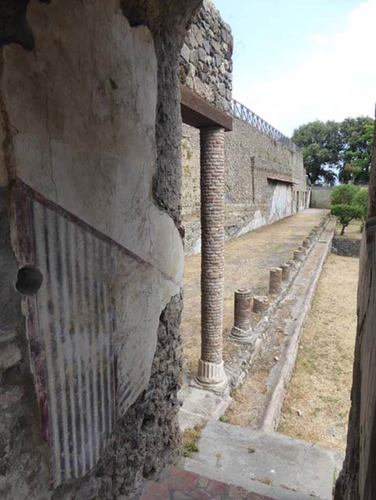 VIII.1.a, Pompeii. June 2017. Looking south down steps from landing to portico.
Photo courtesy of Michael Binns.