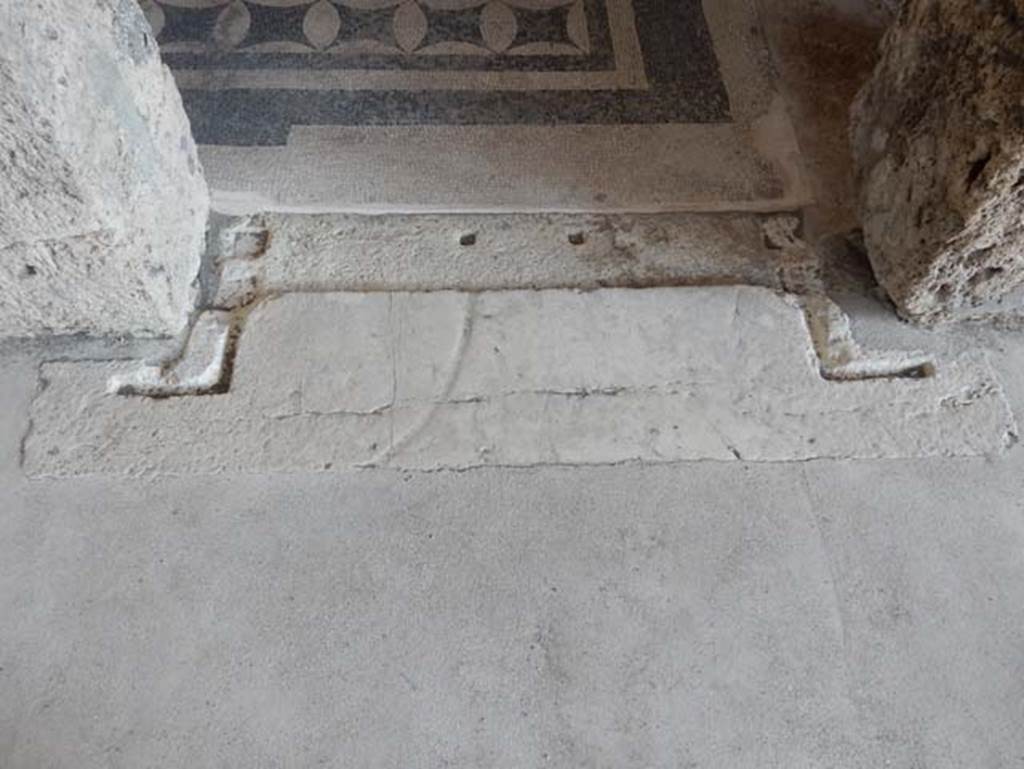VIII.2.1 Pompeii. May 2018. Threshold of doorway to triclinium on east side of atrium.
Photo courtesy of Buzz Ferebee.
