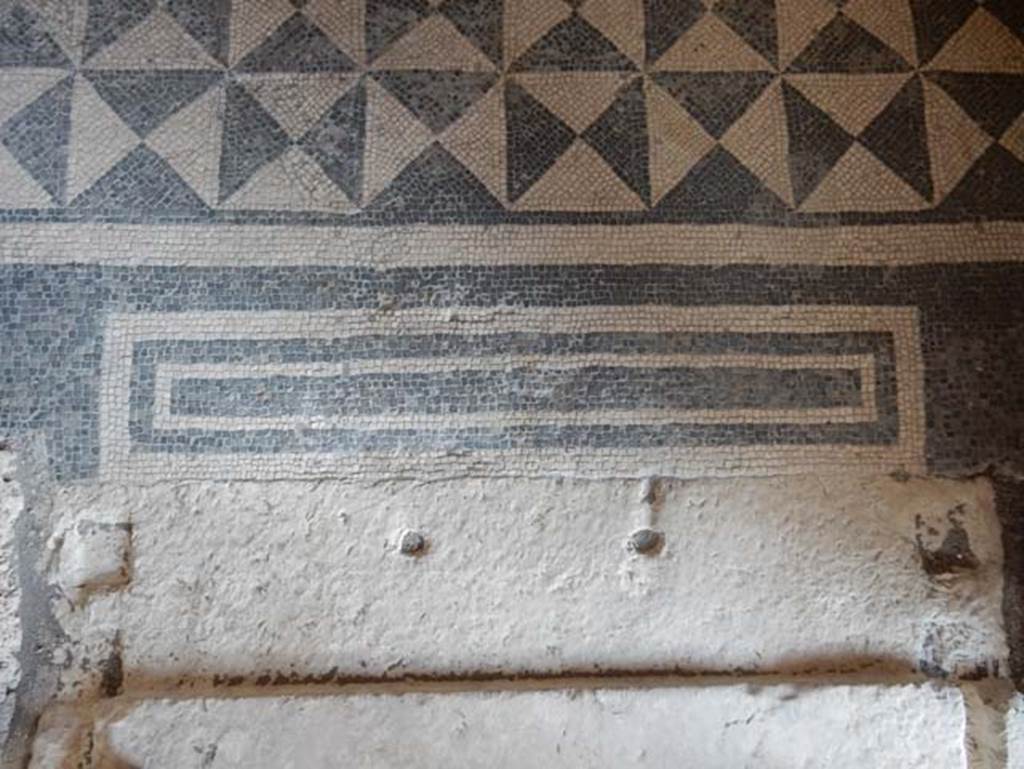 VIII.2.1 Pompeii. May 2018. Detail of flooring in doorway to ala from east side of atrium. Photo courtesy of Buzz Ferebee.
