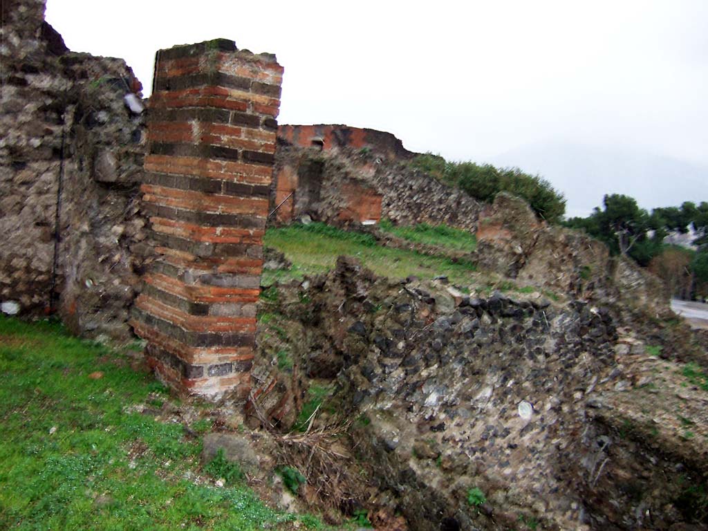 VIII.2.3 view from Casa di Championnet II. December 2005.
Looking south-east from doorway on south side of peristyle/garden into to area of collapsed oecus, on right.
The rooms at the rear of the peristyle garden, the oecus with a room on either side of it, would have all enjoyed fine views from the terrace on their south side. Looking across towards the rear of VIII.2.16.